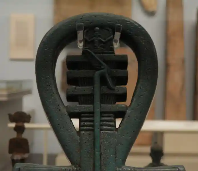 Combination of ankh, djed and was-scepter forming a cross
